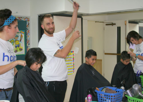 Episcopal Church of the Redeemer’s “Day of Hope” provides much-needed supplies and haircuts as Sarasota, Florida kids prepare to go back to school. Photo: Episcopal Diocese of Southwest Florida