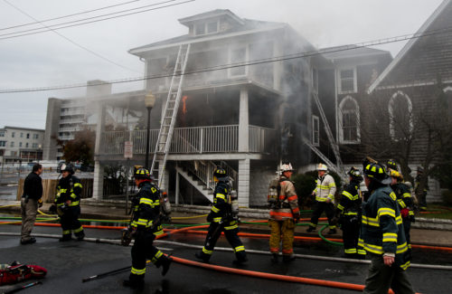 Ocean City firefighters work to extinguish a blaze in the rectory of St. Paul's by the Sea Tuesday morning. Grant L. Gursky