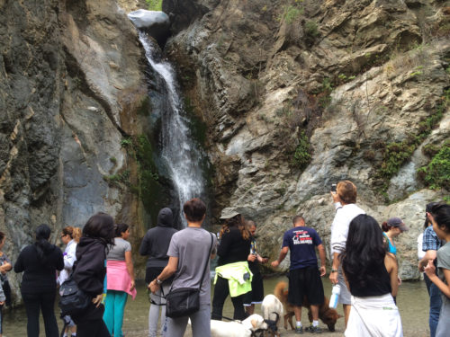Hikers rest and reflect upon reaching the 40-foot Eaton Canyon waterfall in the San Gabriel Mountains near Pasadena, California. Photo: Pat McCaughan