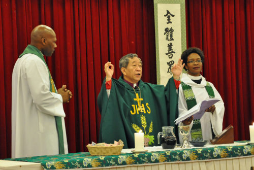 Taiwan Bishop David Jung-Hsin Lai presides at the closing Eucharist Sept. 23 at the House of Bishops’ meeting in Taipei. The Rev. Stephanie Spellers and the Rev. Simon Bautisa Betances, chaplains to the bishops, assisted at Eucharist. Photo: Mary Frances Schjonberg/Episcopal News Service