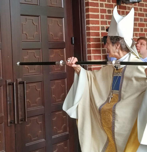 Presiding Bishop Katharine Jefferts Schori knocks three times on the door to Virginia Theological Seminary’s new Immanuel Chapel at the beginning of the building’s dedication and consecration Oct. 13. Photo: Virginia Theological Seminary