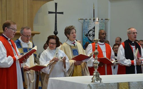 Diocese of Virginia Bishop Shannon Johnston, Virginia Theological Seminary Dean Ian Markham, Deacon Susan Ackley Lukens, Presiding Bishop Katharine Jefferts Schori, Presiding Bishop-Elect Michael Curry and Archbishop of Canterbury Justin Welby sing Oct. 13 at the altar in Immanuel Chapel during the building’s dedication and consecration Eucharist. Photo: Richard Schori