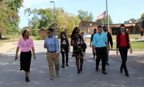 Shawntelle Fisher of SoulFisher Ministries and Cornita Robinson, director of development for St. Stephen’s & The Vine, lead pilgrims on a walk from Koch Elementary School to the Michael Brown memorial site. Photo: Lynette Wilson/Episcopal News Service 