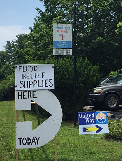 Signs outside St. James’ Episcopal Church, Lewisburg, direct those in need and point to post-flood partnerships.